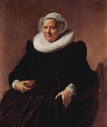 Bild:Portrait einer sitzenden, etwa sechzigjährigen Frau mit Buch in der rechten Hand