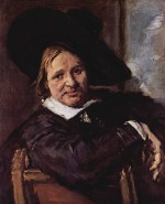 Bild:Portrait eines sitzenden Mannes mit schraegem Hut, den rechten Arm auf der Stuhllehne