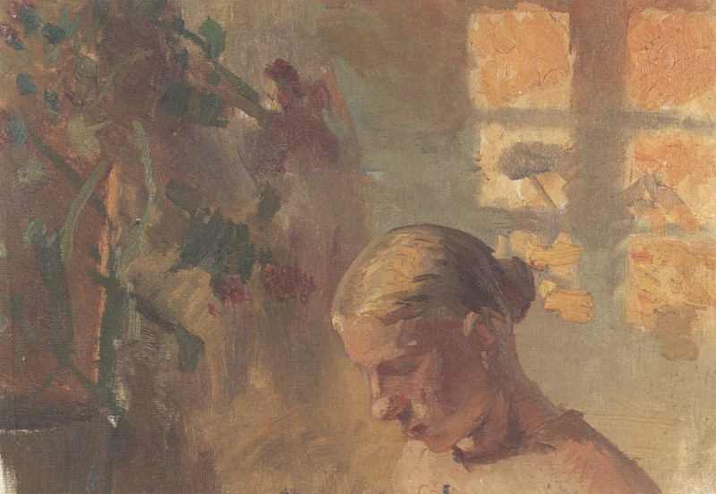 Naehendes Maedchen vor einer sonnenbeschienenen Wand