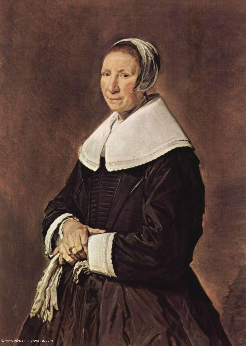 Portrait einer stehenden Frau mit Handschuhen in den Haenden