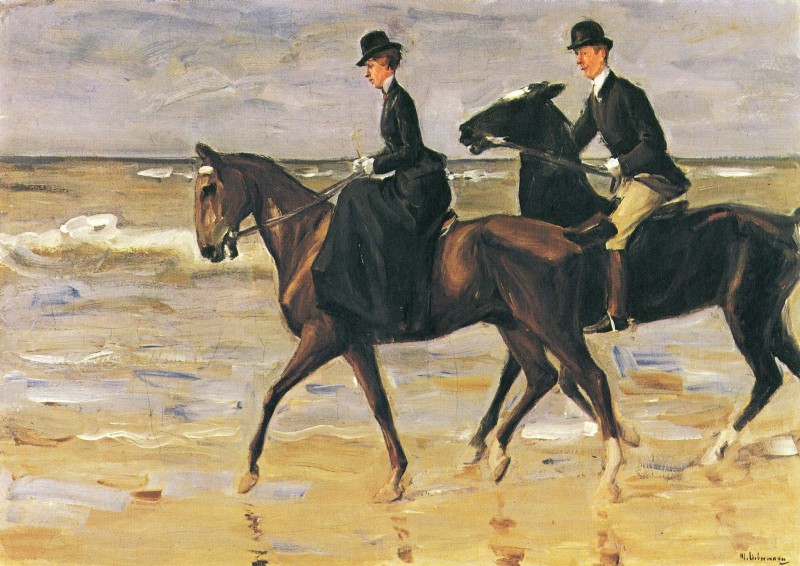 Reiter und Reiterin am Strand