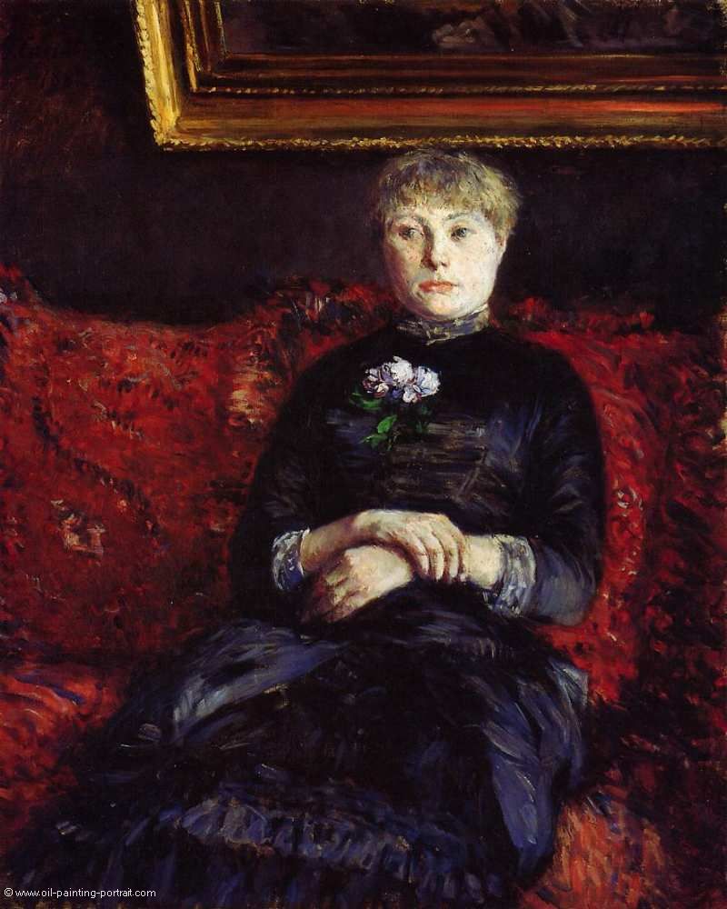 Woman Sitting on a Red Flowered Sofa