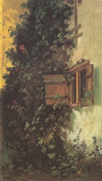 Bild:Mur de la maison avec fenêtred´écurie et haie de roses