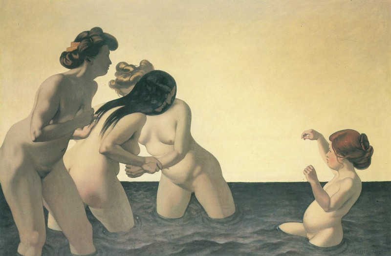 Drei Frauen und ein Mädchen im Wasser spielend