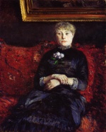 Bild:Femme assise sur un canapé rouge fleuri