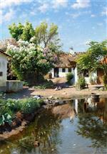 Bild:Spring day at a thatched house with blooming lilacs