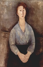 Bild:Femme assise avec chemisier bleu